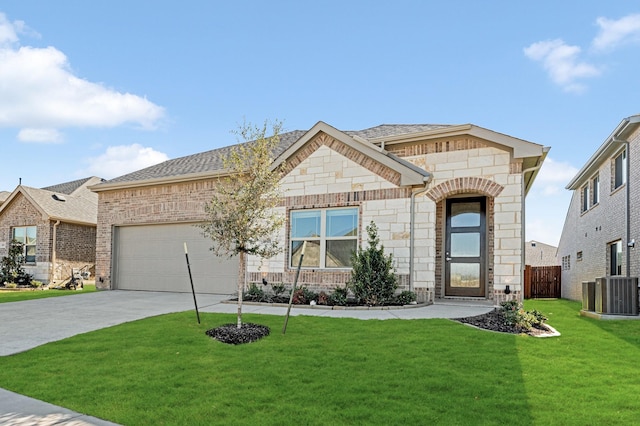 single story home featuring central AC, a front yard, and a garage