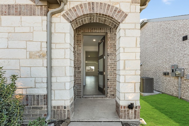 doorway to property featuring cooling unit