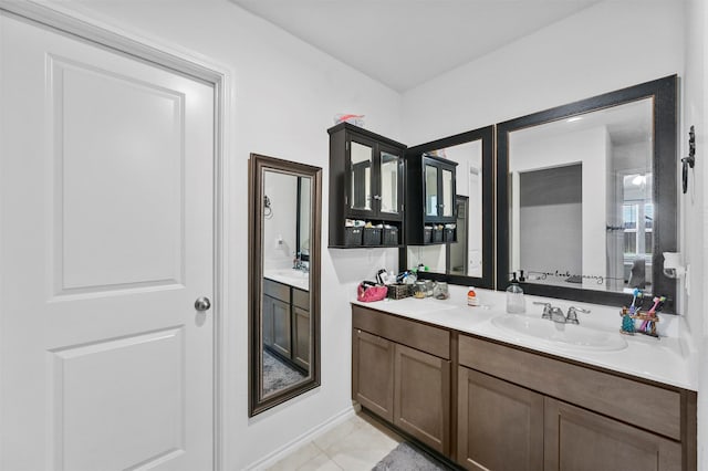 bathroom featuring tile patterned flooring and vanity