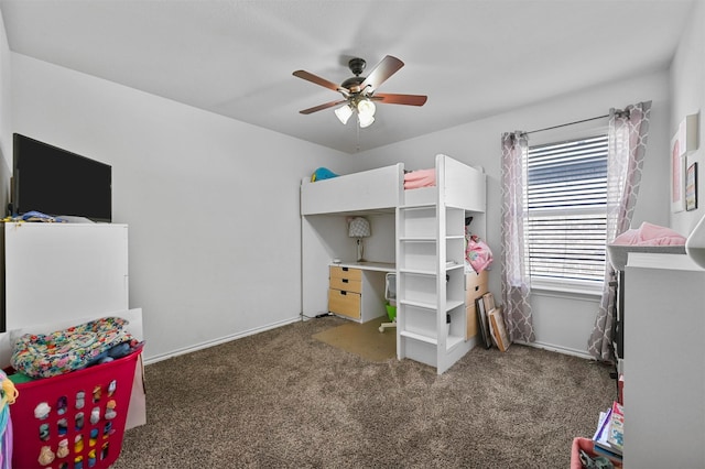 bedroom with ceiling fan and dark carpet