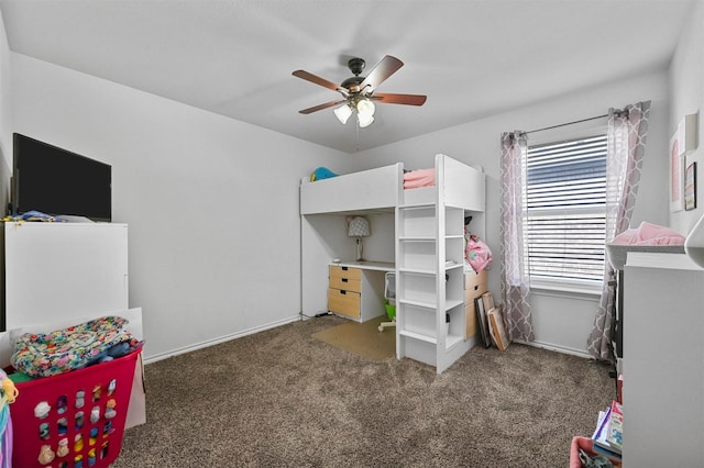 carpeted bedroom with baseboards and ceiling fan