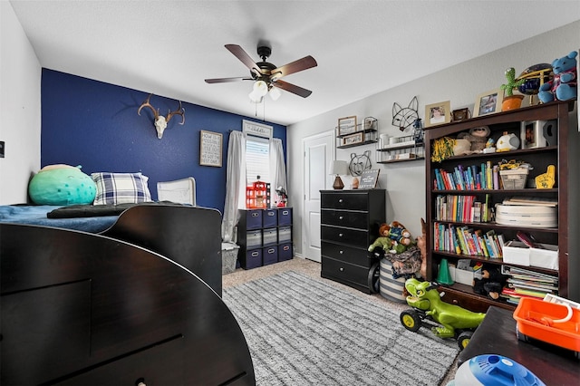 bedroom featuring a ceiling fan and carpet floors