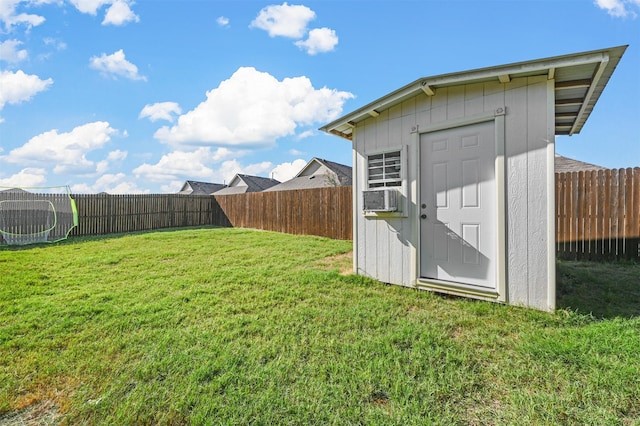 view of yard with cooling unit and a shed