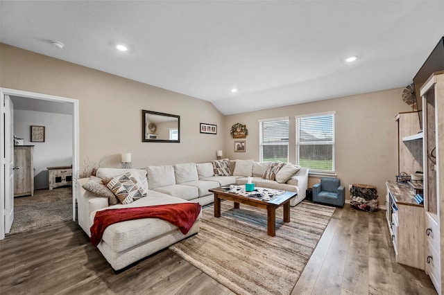 living room with vaulted ceiling and dark wood-type flooring