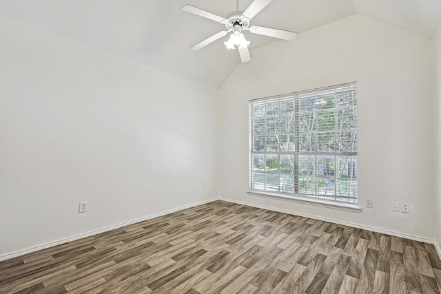 empty room featuring wood-type flooring, lofted ceiling, and ceiling fan