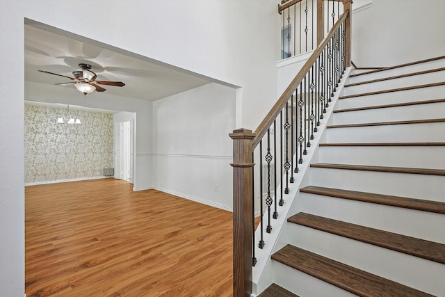 staircase featuring wood-type flooring