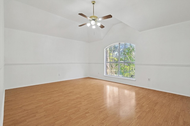 unfurnished room with light hardwood / wood-style floors, vaulted ceiling, and ceiling fan