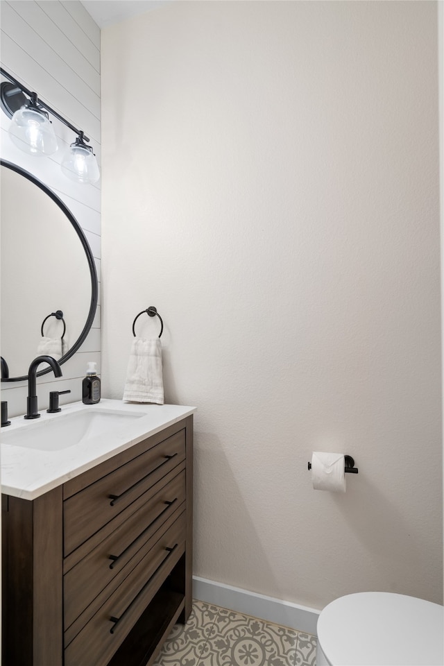 bathroom with vanity and toilet