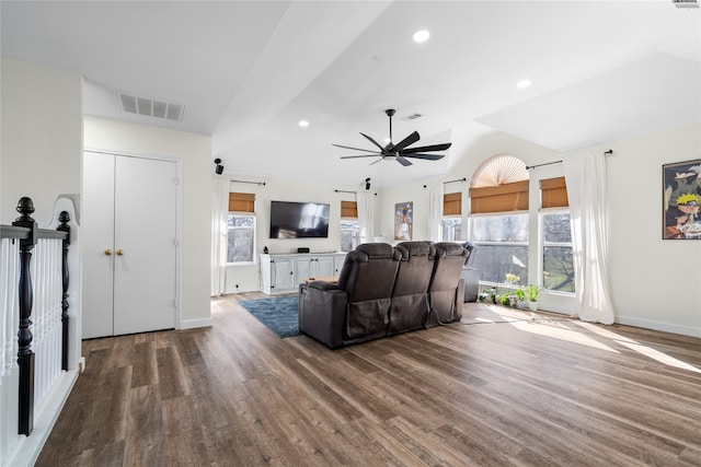 living room featuring wood-type flooring, vaulted ceiling, and ceiling fan