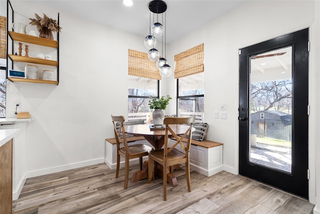 dining area with a chandelier and light hardwood / wood-style floors