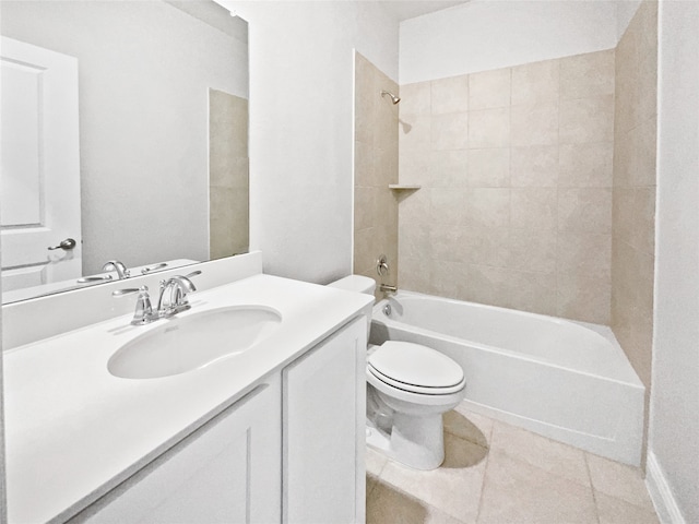 full bathroom featuring tiled shower / bath, vanity, toilet, and tile patterned floors