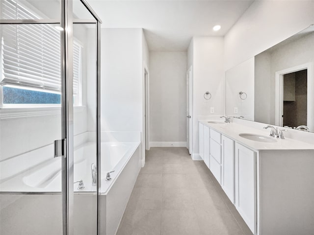 bathroom featuring ceiling fan, vanity, and separate shower and tub