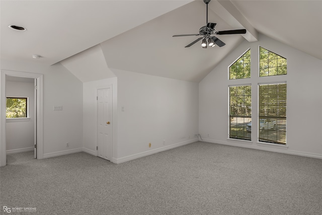 bonus room featuring light colored carpet, vaulted ceiling with beams, and ceiling fan