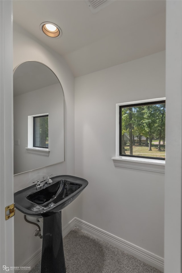 bathroom with vaulted ceiling