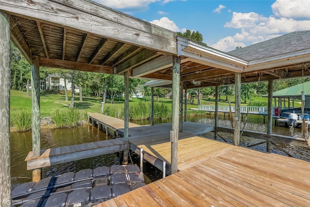 dock area with a water view