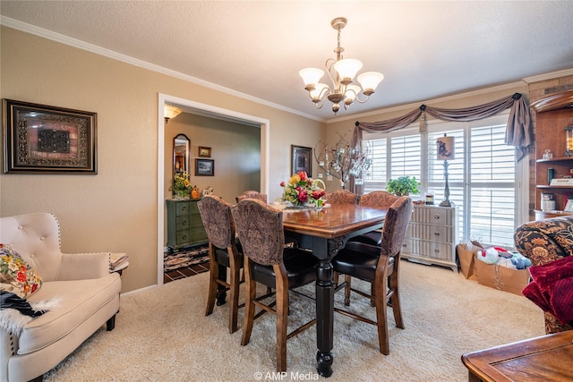 carpeted dining room with an inviting chandelier, ornamental molding, and a textured ceiling