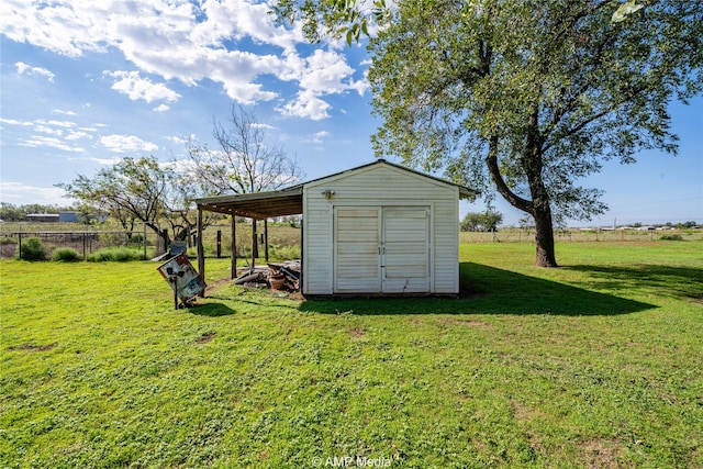 view of outdoor structure featuring a lawn