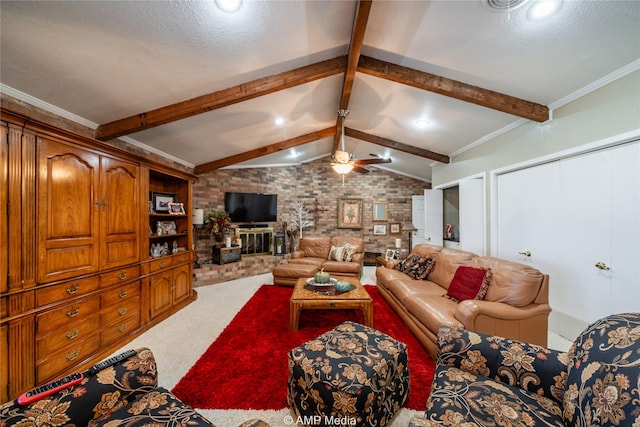 living room with ceiling fan, carpet flooring, a fireplace, ornamental molding, and lofted ceiling with beams