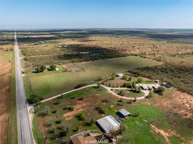 birds eye view of property with a rural view