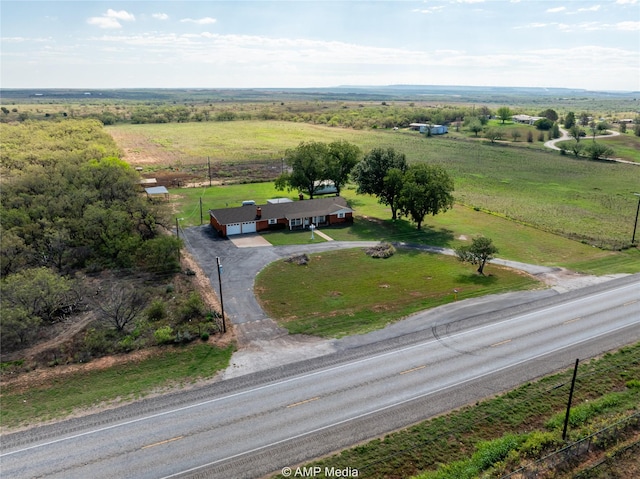 birds eye view of property with a rural view