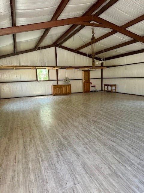 garage featuring wood walls