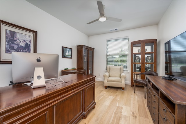 home office with ceiling fan and light wood-type flooring