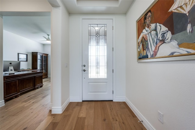 entrance foyer with ceiling fan and light wood-type flooring