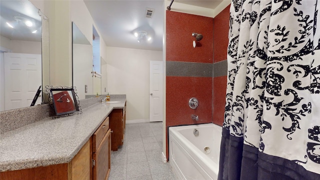 bathroom featuring a bathtub, tile patterned flooring, and vanity