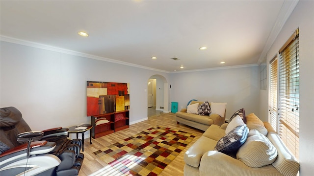 living room featuring light wood-type flooring and ornamental molding