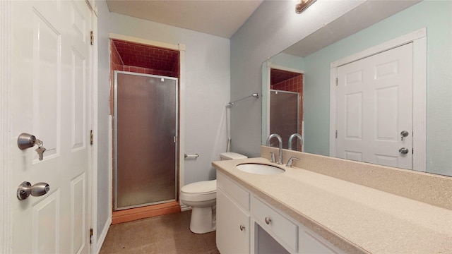 bathroom featuring vanity, toilet, and an enclosed shower