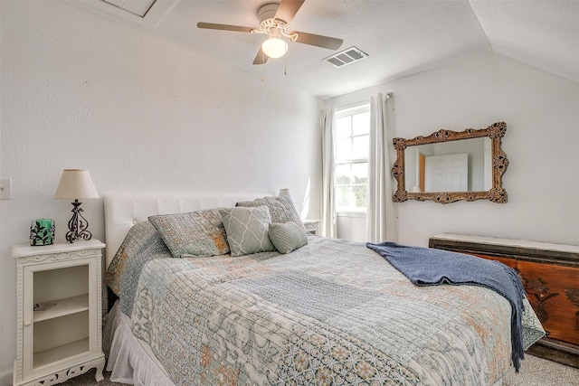 bedroom with lofted ceiling, ceiling fan, and visible vents