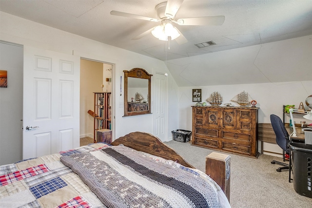 bedroom with a ceiling fan, lofted ceiling, and light carpet