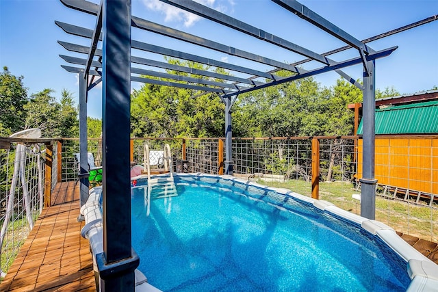 view of swimming pool with a fenced in pool, fence, and a pergola