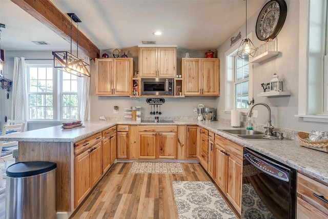 kitchen featuring open shelves, a sink, light countertops, black appliances, and decorative light fixtures