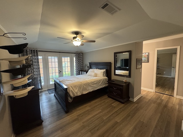 bedroom featuring access to outside, dark hardwood / wood-style flooring, ornamental molding, ceiling fan, and french doors