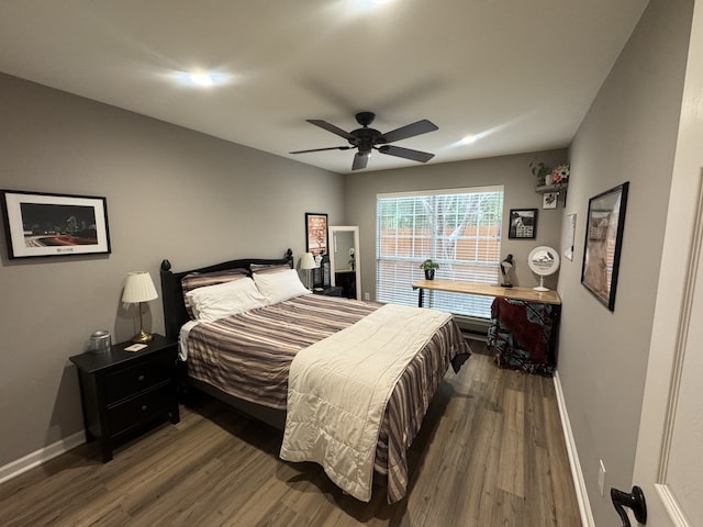 bedroom featuring ceiling fan and dark hardwood / wood-style flooring