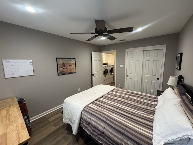 bedroom featuring ceiling fan, a closet, dark hardwood / wood-style flooring, and washing machine and clothes dryer