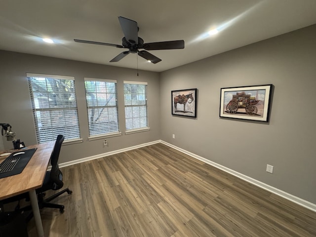 unfurnished office featuring ceiling fan and hardwood / wood-style flooring