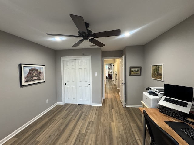 home office featuring ceiling fan and hardwood / wood-style flooring