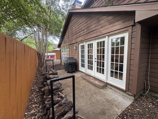 view of side of home with french doors and a patio area