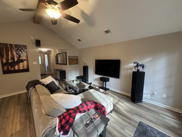 living room featuring wood-type flooring, lofted ceiling with beams, and ceiling fan