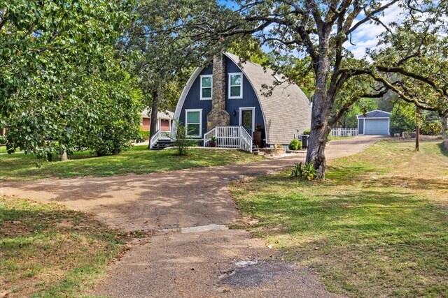 315 Highlander Hts, Hideaway, TX 75771 - a-frame home featuring a front yard and aphalt driveway