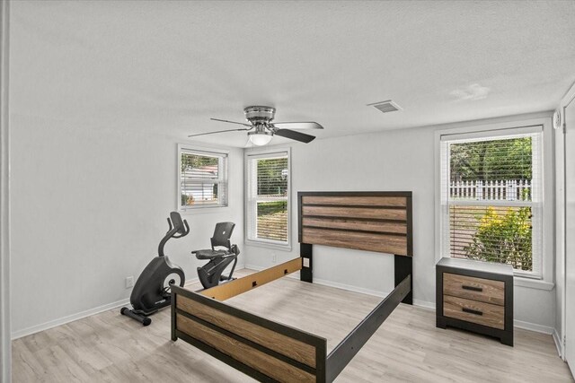 315 Highlander Hts, Hideaway, TX 75771 - bedroom featuring light wood-style flooring, visible vents, and multiple windows