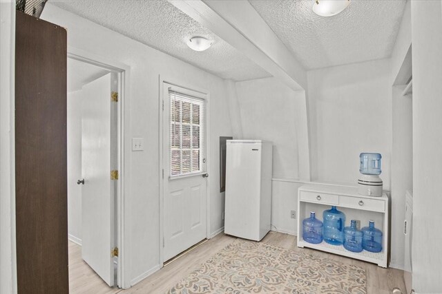 315 Highlander Hts, Hideaway, TX 75771 - washroom with light wood-type flooring and a textured ceiling