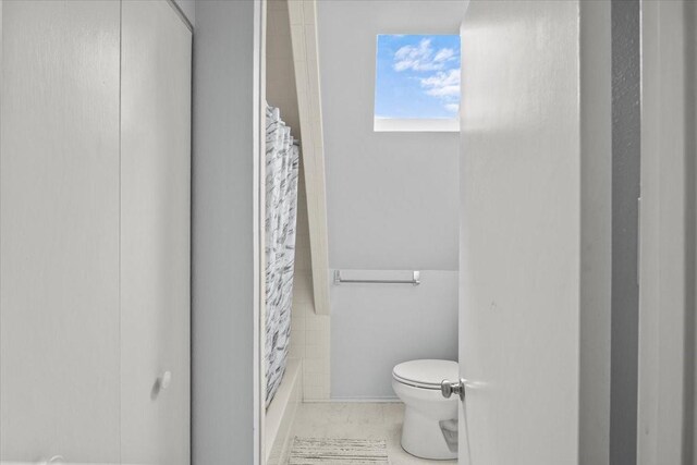 315 Highlander Hts, Hideaway, TX 75771 - full bathroom with toilet and shower / bath combination with curtain