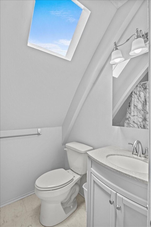 315 Highlander Hts, Hideaway, TX 75771 - bathroom featuring marble finish floor, toilet, and vanity