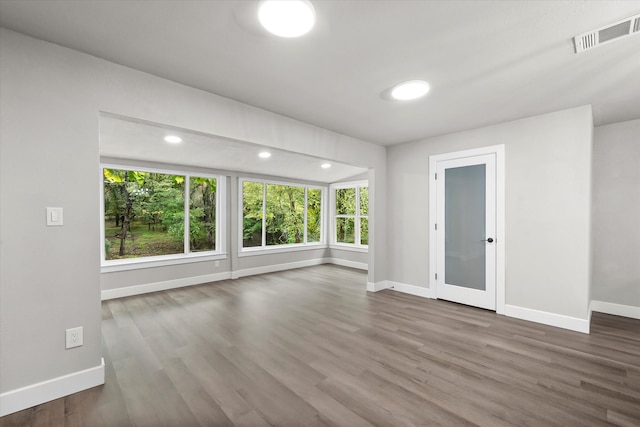 empty room with wood-type flooring