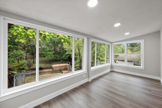 unfurnished sunroom with vaulted ceiling and a wealth of natural light