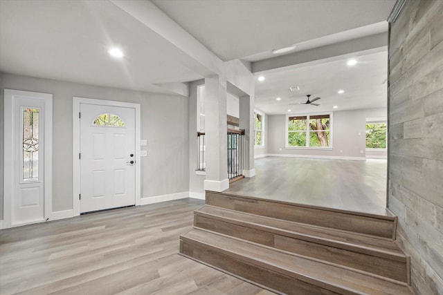 foyer entrance with recessed lighting, a ceiling fan, wood finished floors, and baseboards