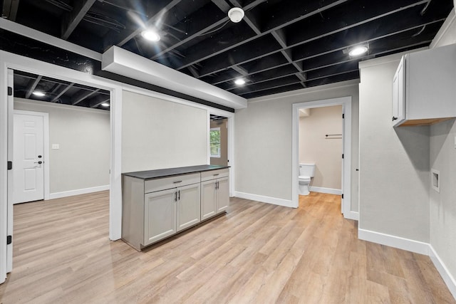 basement with light wood finished floors and baseboards
